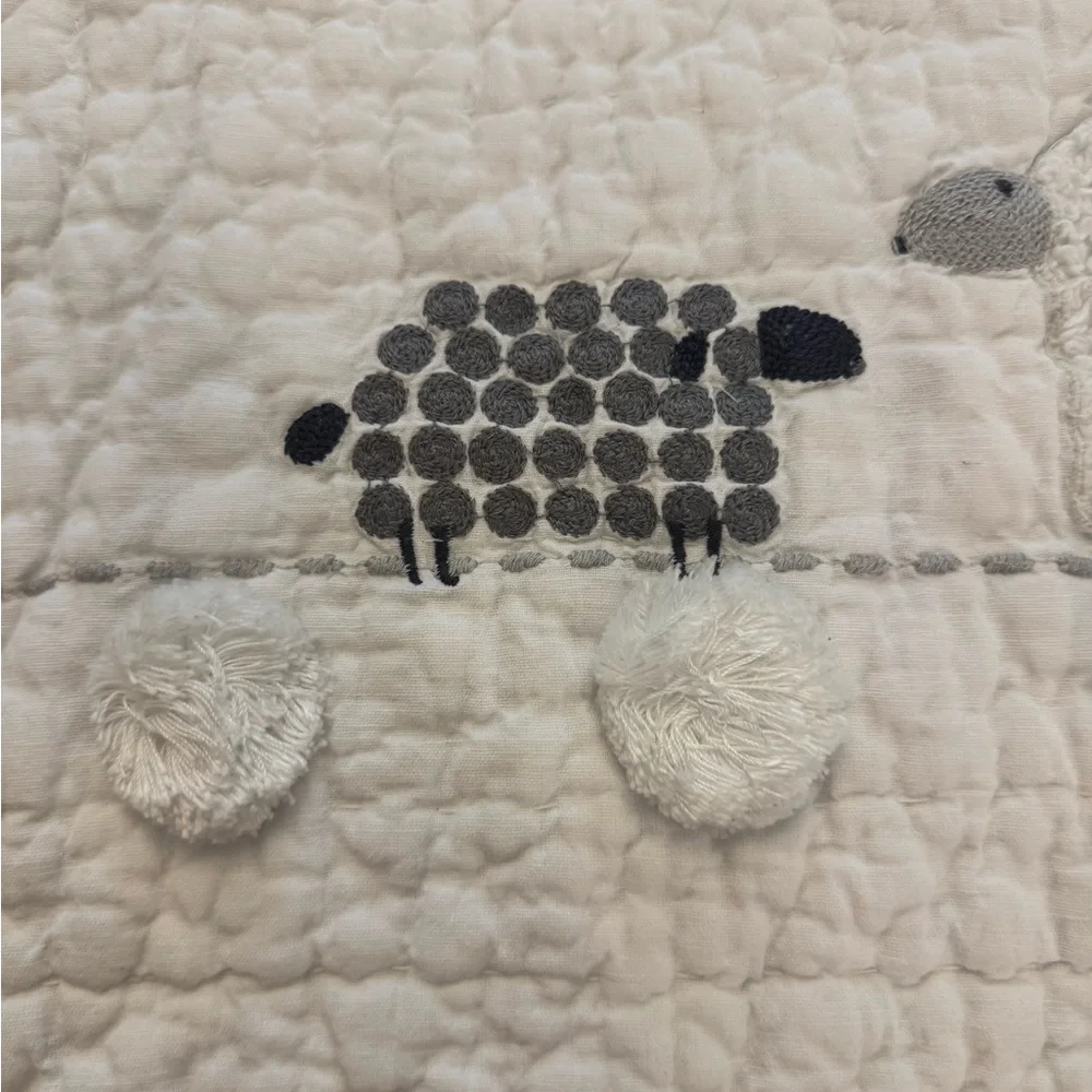 Pottery Barn Kids Shelby Sheep Baby Quilt features textured Sherpa sheep